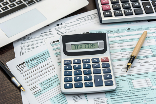 Financial,Time,Tax,Form,With,Laptop,And,Calculator.,Office,Paperwork.